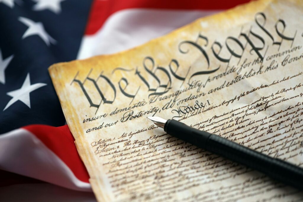 Happy USA - Independence Day Preamble to the Constitution of the United States and American Flag close up